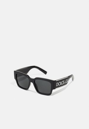Black rectangular sunglasses with dark lenses, featuring a glossy finish and "DOLCE & GABBANA" logo in white on the sides.