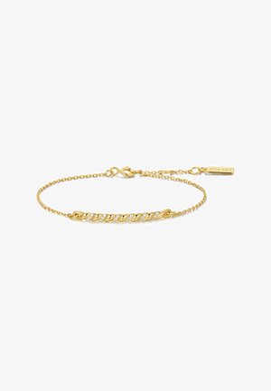 Bracelet délicat en chaîne d'or avec un design de barre torsadée, orné de petites pierres précieuses claires incrustées, et une fermeture à fermoir mousqueton.