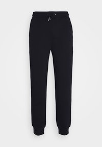 Pantaloni della tuta neri realizzati in tessuto morbido, con una vita elasticizzata e cordino regolabile, caviglie elastiche e tasche laterali.