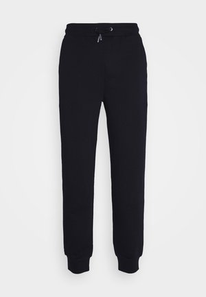 Pantalons de survêtement noirs en tissu doux, dotés d'une taille élastique avec cordon de serrage réglable, de chevilles côtelées et de poches latérales.