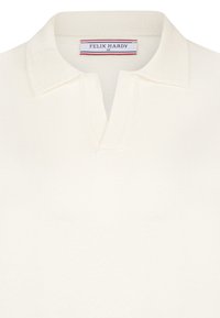 Valge polo särk tekstuuriga kraega, millel on osaline nööbilõige. Etiketil on kirjas "FELIX HARDY" ja suurus "M".