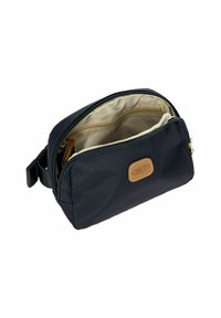 Borsa cosmetica in nylon blu navy con zip dorata, dettagli in pelle beige e interno beige. Presenta un vano principale e una piccola tasca con zip.