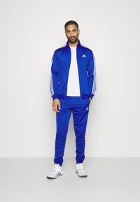 adidas Sportswear - BASIC TRACKSUIT - Treniņtērps - semi lucid blue Miniatūras attēls 1