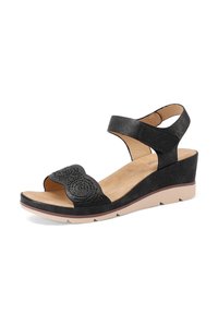 Sandali wedge neri con una parte superiore texturizzata, caratterizzati da un design decorativo a ritaglio e da una cinghia alla caviglia regolabile. Suola leggera per il massimo comfort.