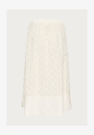 Weißer Rock aus strukturiertem Stoff mit erhabenen Blumenmustern an der Oberseite und einem glatten Baumwollsaum, versehen mit seitlichen Schlitzen. Elastischer Bund.