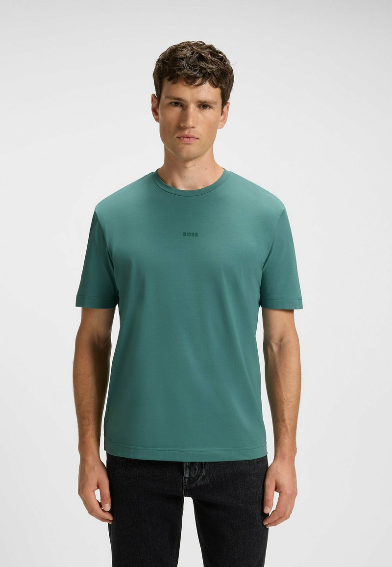 Dark green short-sleeved t-shirt made of smooth fabric, featuring a crew neck and a subtle logo in the center of the chest.