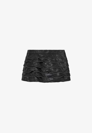 Black leather mini skirt with layered ruffles and silver zippers along the edges, featuring a smooth texture and a fitted silhouette.