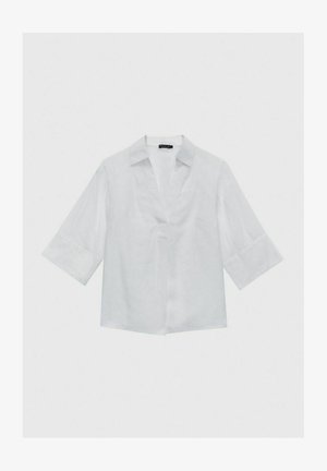 Chemise en lin blanche avec col, manches courtes et coupe décontractée. Présente un décolleté en V et un design minimaliste. Texture lisse.