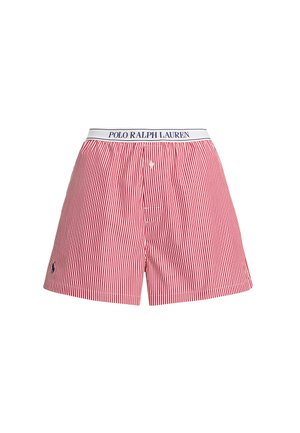 Boxers à rayures verticales rouges et blanches avec une braguette à boutons et une ceinture blanche portant la mention "Polo Ralph Lauren" en bleu.