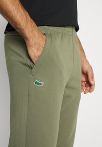 Lacoste Sport SPORTS TROUSERS - Calças de fato de treino - tank