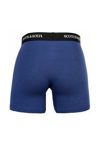 Dunkelblaue Boxershorts mit einem schwarzen Bund, auf dem "SCOTCH & SODA" steht, aus glattem Stoff und mit eng anliegendem Design.