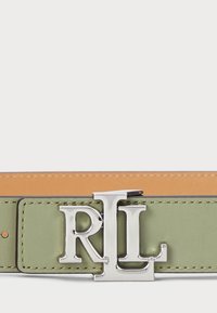 Green leather belt featuring silver logo buckle, contrast stitching, and a smooth finish. Inner side is a lighter tan color.