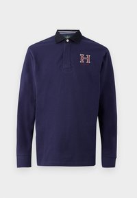 Polo de manga longa azul-marinho com colarinho preto, logótipo 'H' bordado e detalhes riscalhados no colarinho interior. Feito em algodão.