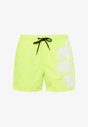 Shorts da bagno giallo neon realizzati in tessuto leggero, con cordino nero e un ampio motivo floreale bianco sul lato sinistro.