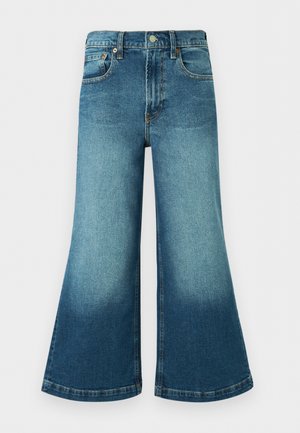 Weit geschnittene blaue Jeans aus Denim mit hohem Bund, vorderer Knopfleiste, Gürtelschlaufen und verwaschenen Details an Oberschenkeln und unteren Beinen.