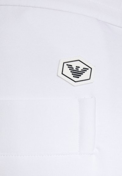 Emporio Armani TROUSER - Calças de fato de treino - bianco ottico
