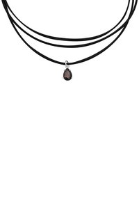 Black suede choker with three strands and a pear-shaped dark gemstone pendant set in silver. Smooth texture and modern design.