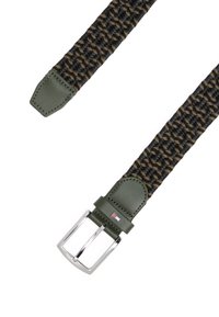 Woven fabric belt in black and olive green, featuring a leather tip and a silver metal buckle. Notable Tommy Hilfiger logo on the buckle.