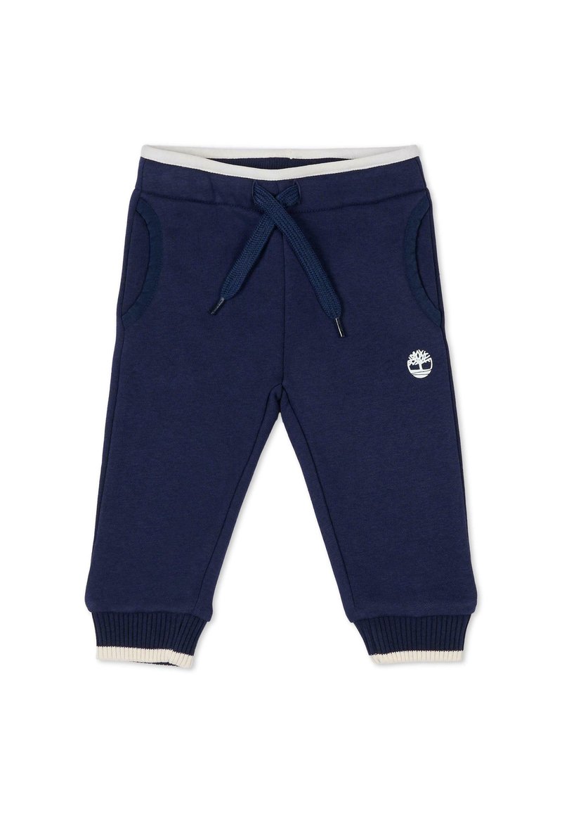 Marineblauwe joggingsbroek met een tailleband met trekkoord, zijzakken, geribde manchetten en een klein wit logo op het linkerpijpen. Zacht, katoenmix materiaal.
