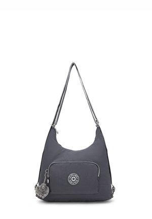 Sac à bandoulière Kipling gris foncé avec poche zippée à l'avant et petit porte-clés singe en peluche attaché au curseur de la fermeture éclair.