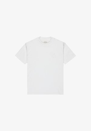 T-shirt en coton blanc avec un col rond. Présente un logo RVCA brodé discret sur la poitrine gauche. Manches courtes, texture lisse.