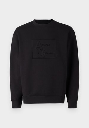 Felpa nera con scollatura a girocollo, con logo Armani Exchange in rilievo al centro. Realizzata in tessuto morbido con una vestibilità rilassata.