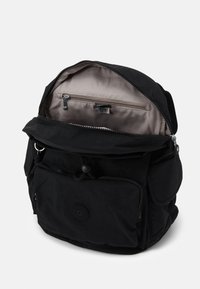 Black backpack made of durable fabric, featuring a zippered main compartment, front pocket with flap, and a subtle logo on the front.