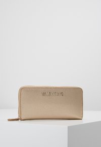 Gold textured wallet with "VALENTINO" embossed logo on the front, featuring a zip closure and slim rectangular shape.
