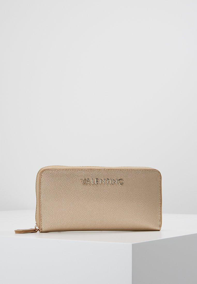 Gold textured wallet with "VALENTINO" embossed logo on the front, featuring a zip closure and slim rectangular shape.