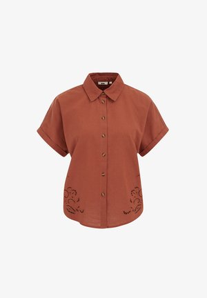 Rdzawo-pomarańczowa koszula na krótki rękaw z kołnierzykiem i guzikami, z kwiatowymi wycięciami przy krawędzi u dołu po obu stronach.