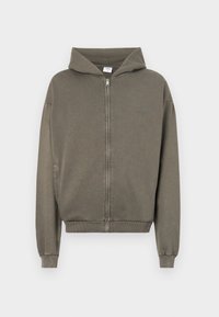 Hooded zip-up sweatshirt in olive green, made from soft cotton blend, featuring ribbed cuffs and hem, with a front patch detail.