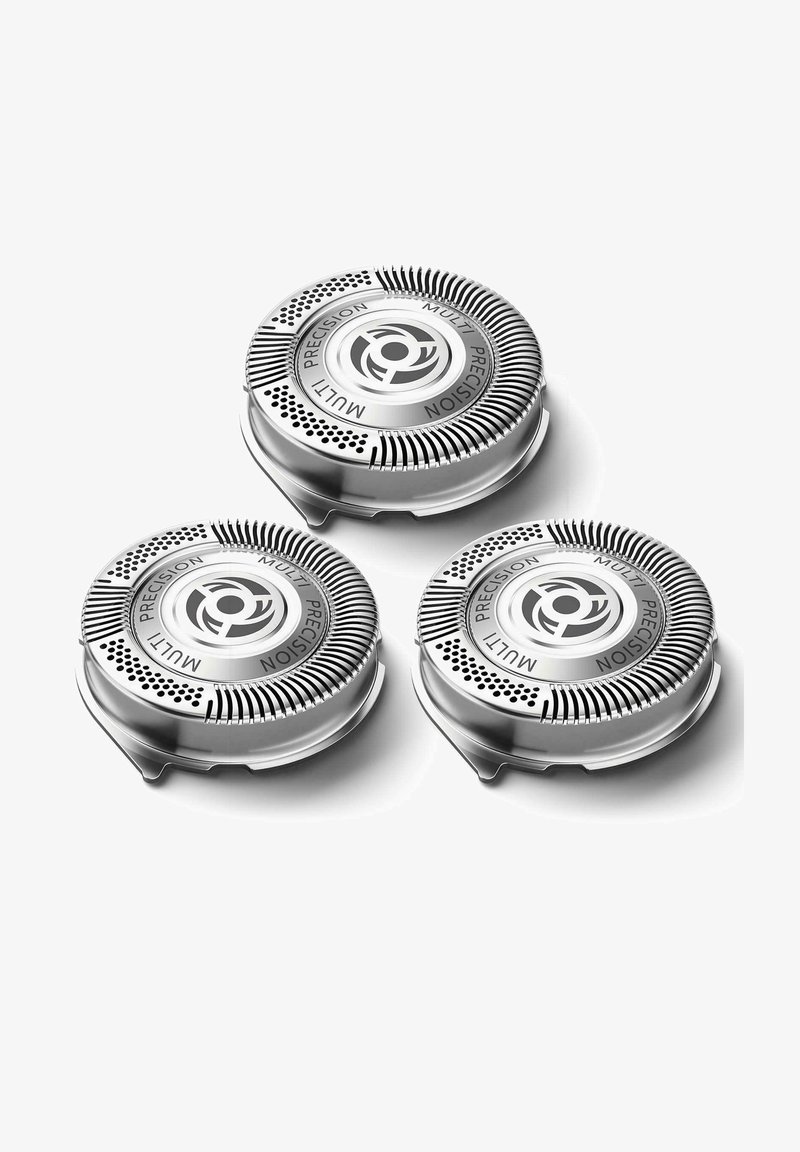 Trois têtes de rasoir circulaires avec une finition métallique. Chacune présente une prise texturée et des trous de ventilation, étiquetés "MULTI PRECISION".