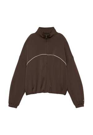 Dunkelbraune Jacke mit Reißverschluss und hohem Kragen, elastischen Bündchen und einer weißen geschwungenen Linie über der Brust und den oberen Ärmeln.