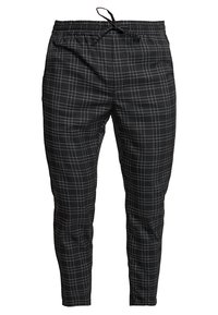 Svart och vit rutiga joggers av lättviktig tyg, med elastisk midja och justerbara dragsko-detaljer.