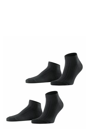 Schwarze Knöchelsocken im gerippten Design, mit verstärkter Ferse und Zehen, weichem Material und elastischem Bündchen für eine bequeme Passform.