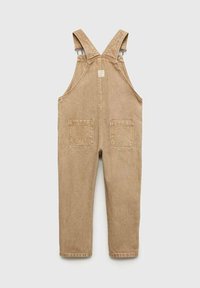 Bretelles en coton tan avec des straps ajustables, deux poches frontales et deux poches arrière. Texture lisse avec des détails de couture subtils.