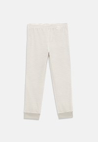 Legginsy w paski w jasnym beżu i kremie, wykonane z miękkiego materiału, z elastycznym paskiem w talii i ściągaczami na kostkach.