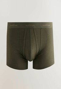 Sötétzöld férfi boxeralsó elülső varrással és "Next Signature" felirattal ellátott márkázott elasztikus derékpánttal.