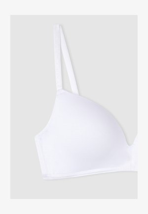 Sino wireless bianco realizzato in cotone liscio, con spalline sottili regolabili e un design senza cuciture, senza hardware o decorazioni visibili.
