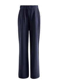 Marineblaue, weit geschnittene Hosen aus weichem Stoff mit elastischem Bund und dezenter Textur. Keine Taschen oder sichtbaren Verschlüsse.