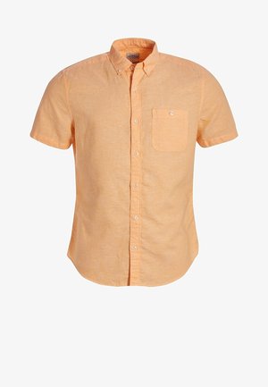 Chemise à manches courtes, boutonnée, en tissu de lin orange clair. Dotée d'une poche poitrine et d'un col avec boutons blancs.