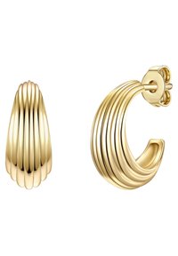 Aukso spalvos auskarai su grioveliuotu dizainu. Vienas yra ašaros formos, o kitas - išlenktas žiedas, abu su blizgiu paviršiumi.