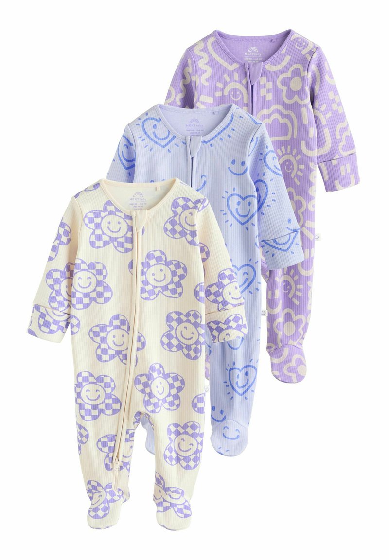 Trois grenouillères en côtes pour enfants dans des couleurs pastel : jaune avec des motifs de fleurs violettes, bleu clair avec des visages souriants, et lavande avec des motifs de soleil.