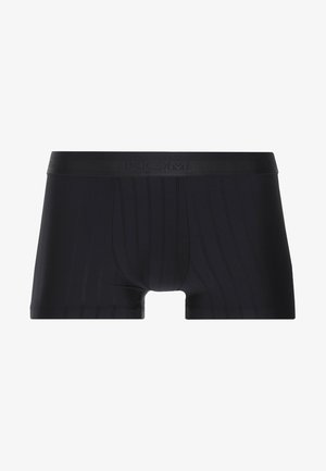 Musta bokserimalliset alushousut, jotka on tehty sileästä, joustavasta kankaasta. Niissä on hillitty pystysauma ja logolla varustettu vyötärönauha lisäämään tukea.