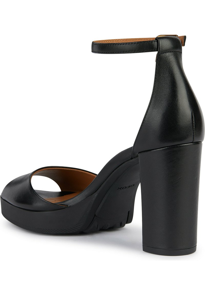Sandal con tacco alto in pelle nera con cinturino alla caviglia, design open-toe e tacco spesso. Texture liscia con suola a piattaforma.