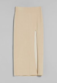 Beige ribbad midikjol med en sidoklyvning, med en mjuk textur och en åtsittande design. Finns i ett slätt tyg med en kontrasterande insida.