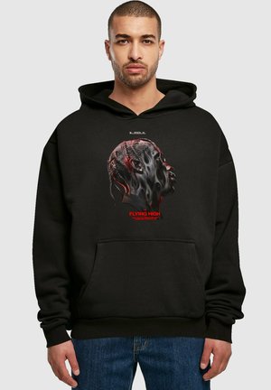 Black hooded sweatshirt featuring a graphic print of a profile with braided hair and red accents. Material appears soft with a front pocket.
