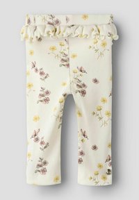 Crème-kleurige legging met bloemenpatronen in roze en geel, met een gerimpelde tailleband en een klein zilveren knoopdetail.