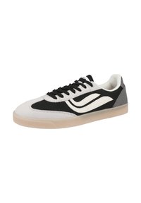 Black and white sneaker featuring a suede and fabric upper, lace-up design, gum sole, and a prominent side wave logo in contrasting color.