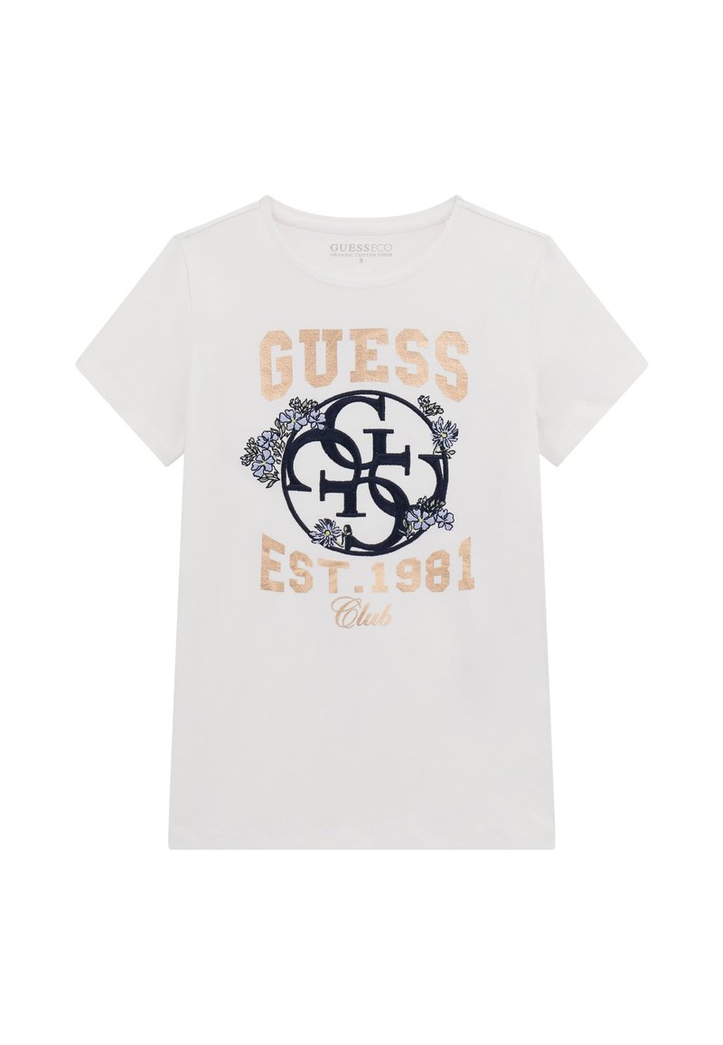 Balts kokvilnas T-krekls ar īsām piedurknēm, kurā redzams zelta un zila "GUESS" logo, dekoratīvi ziedu elementi un teksts "EST. 1981 Club".